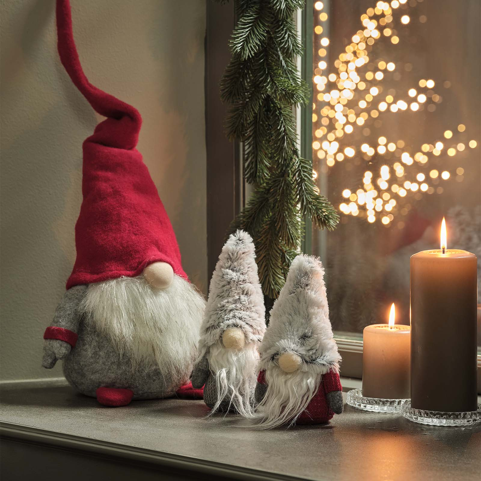 The HERMOD and BROKK Christmas elves have cute button noses and big, white beards Scandinavian Christmas elves with button noses, white beards, and red and grey hats