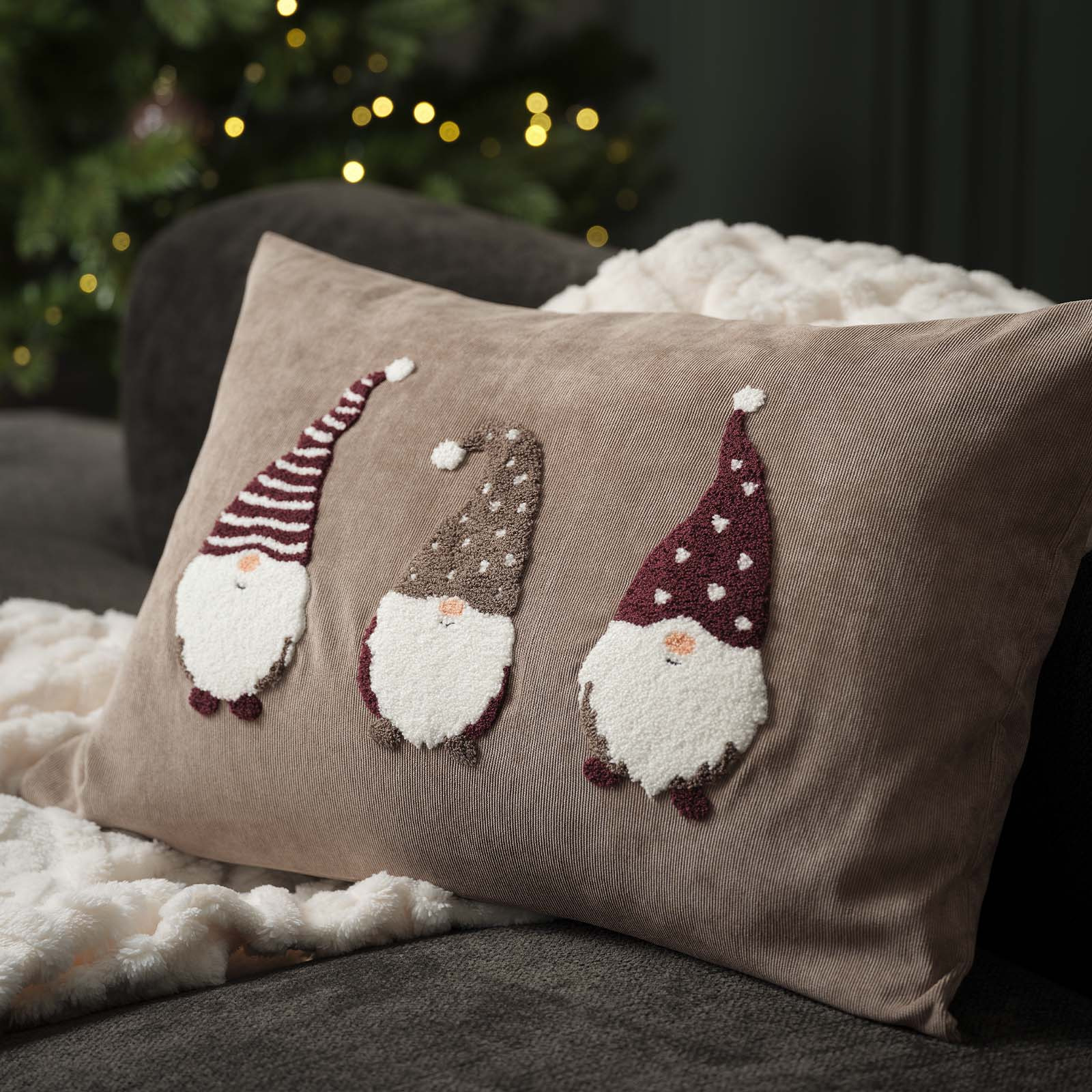 VILJE cushion cover with Christmas elves Sand-coloured cushion cover with embroidered Christmas elves with Christmas hats and big beards