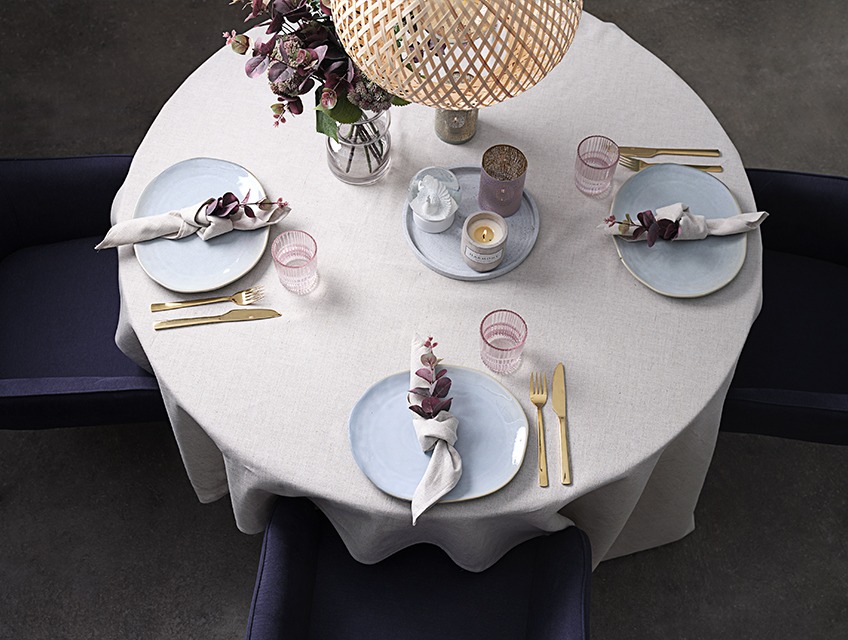 Table set with table cloth, cloth napkins, plates, glasses, vase and candles Table set with table cloth, cloth napkins, plates, glasses, vase and candles