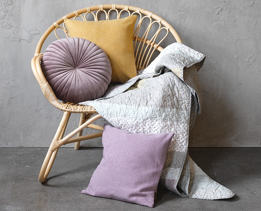 BELLELUND armchair with KUGLEASK and SPARRIS cushions and MAIGULL quilted throw Armchair with cushions and quilted throw in rose, yellow and purple coulours