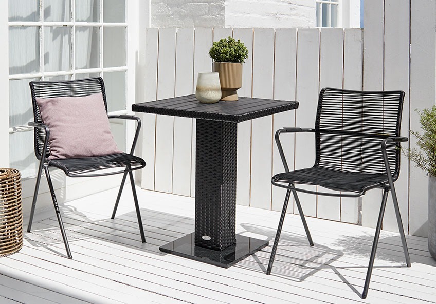 Garden bistro set on a sunny patio or balcony 