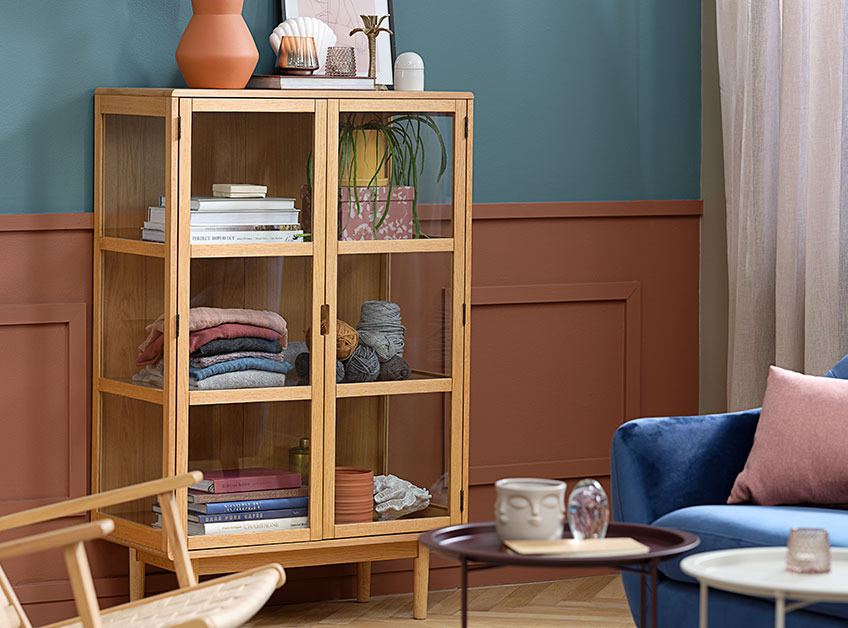 Oak display cabinet in colourful living room 