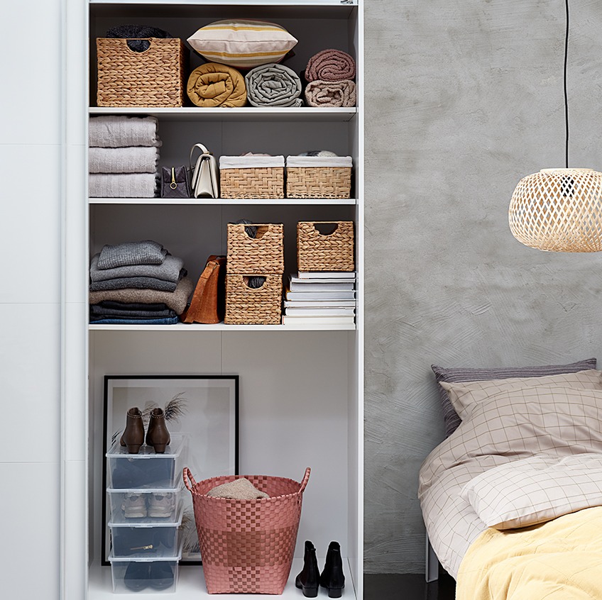 TARP wardrobe with BJORN, EJNO and THERMAN baskets Bedroom with a tidy looking open wardrobe with baskets, stacks of towels and bags