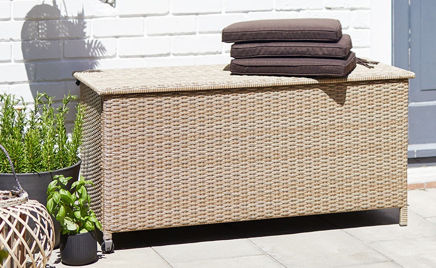 YDERUP cushion box with wheels and a handle Cushion box with handle and wheels on a sunny patio