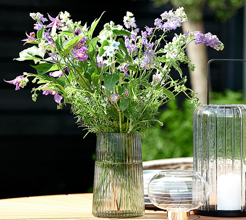Glass vase on a garden table 