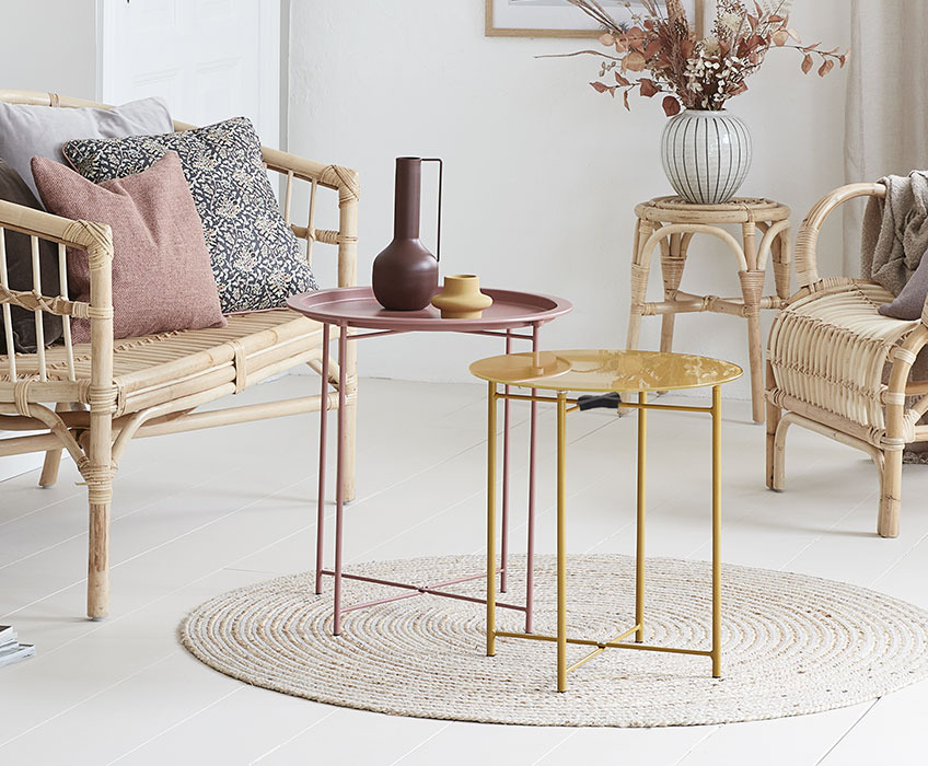 Yellow HORNSYLD end table and RANDERUP dusty rose end table Round end tables in yellow and dusty rose