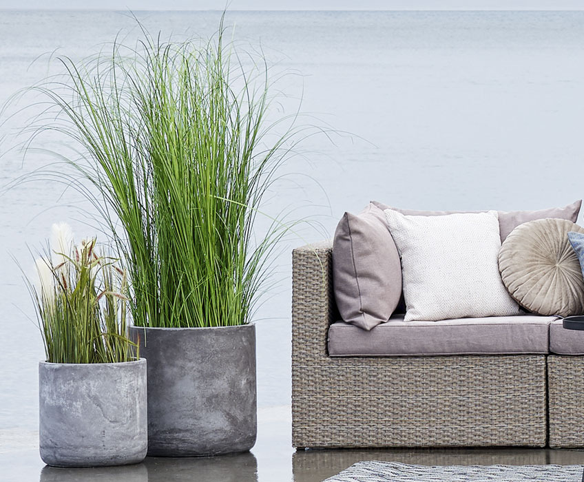 MARKUSFLUE outdoor artificial plants Two grey planters with artificial garden plants