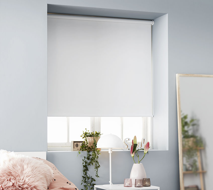 Black-out roller blinds in a girl’s room