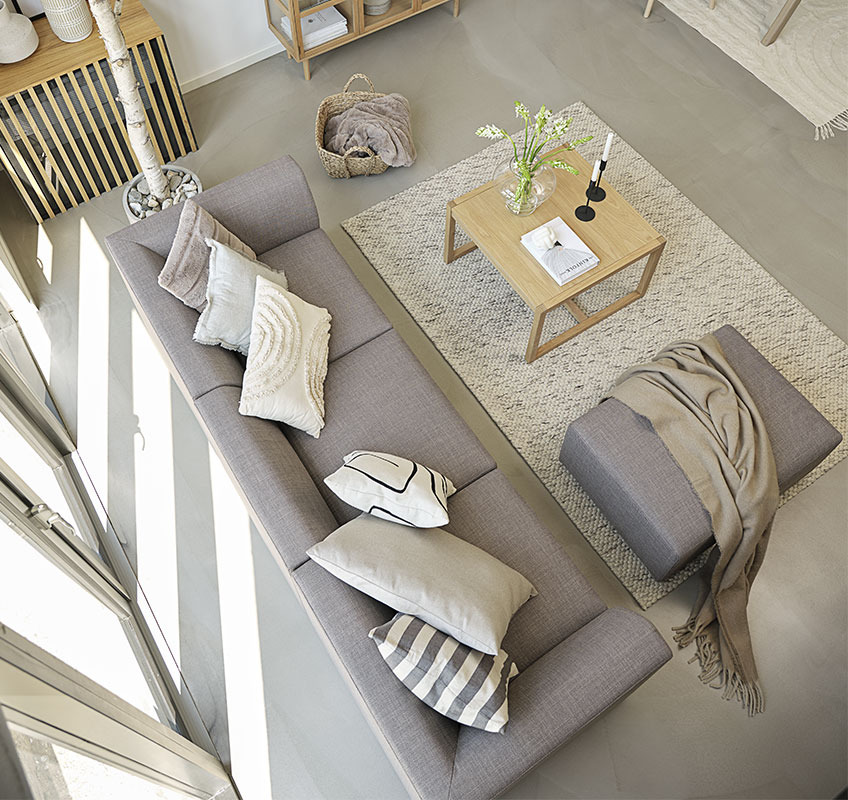 Grey modular sofa and square coffee table in Scandinavian living room