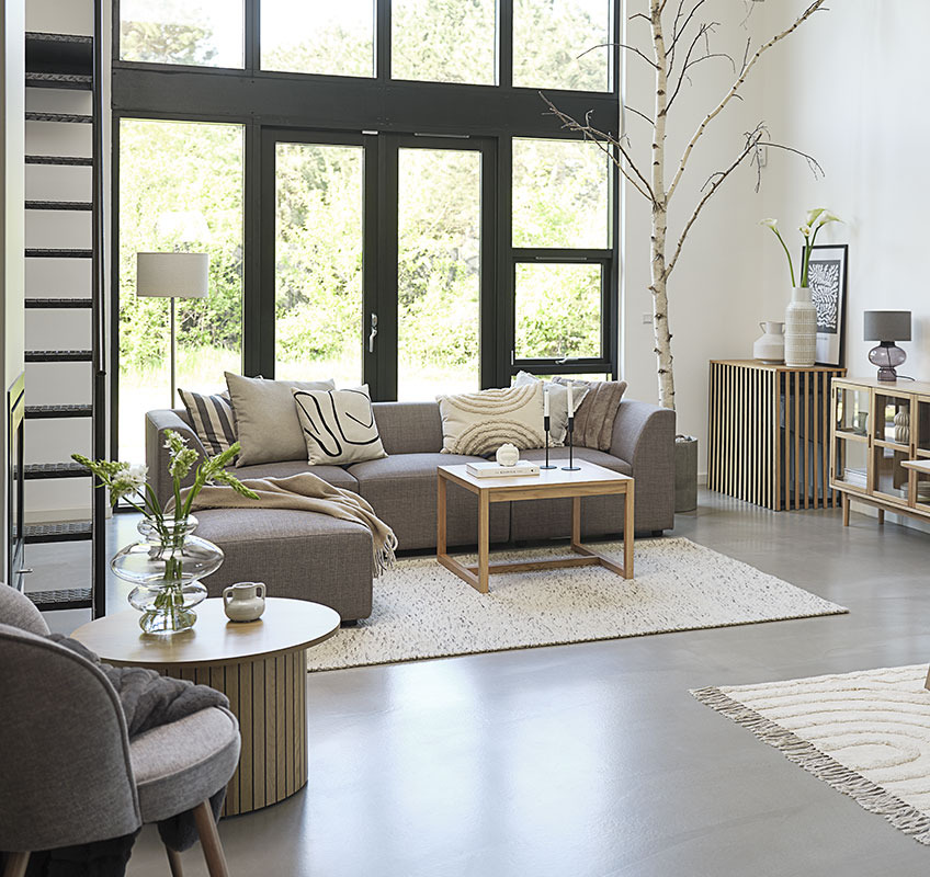Grey modular sofa and square coffee table in Scandinavian living room
