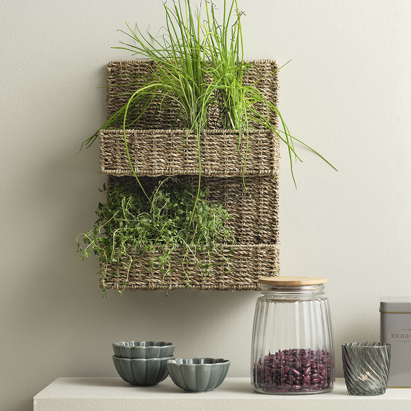 Seagrass basket hanging on a wall in a kitchen