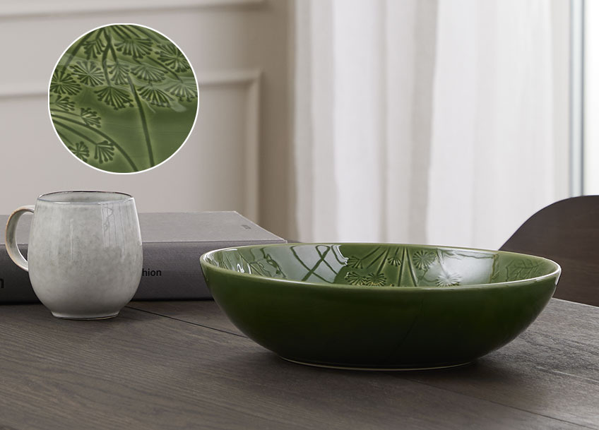 Green salad bowl on a dining table 