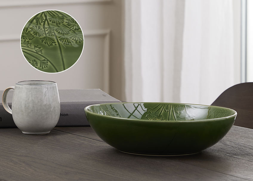 SEBASTIAN bowl and SVERRE mug Green salad bowl on a dining table